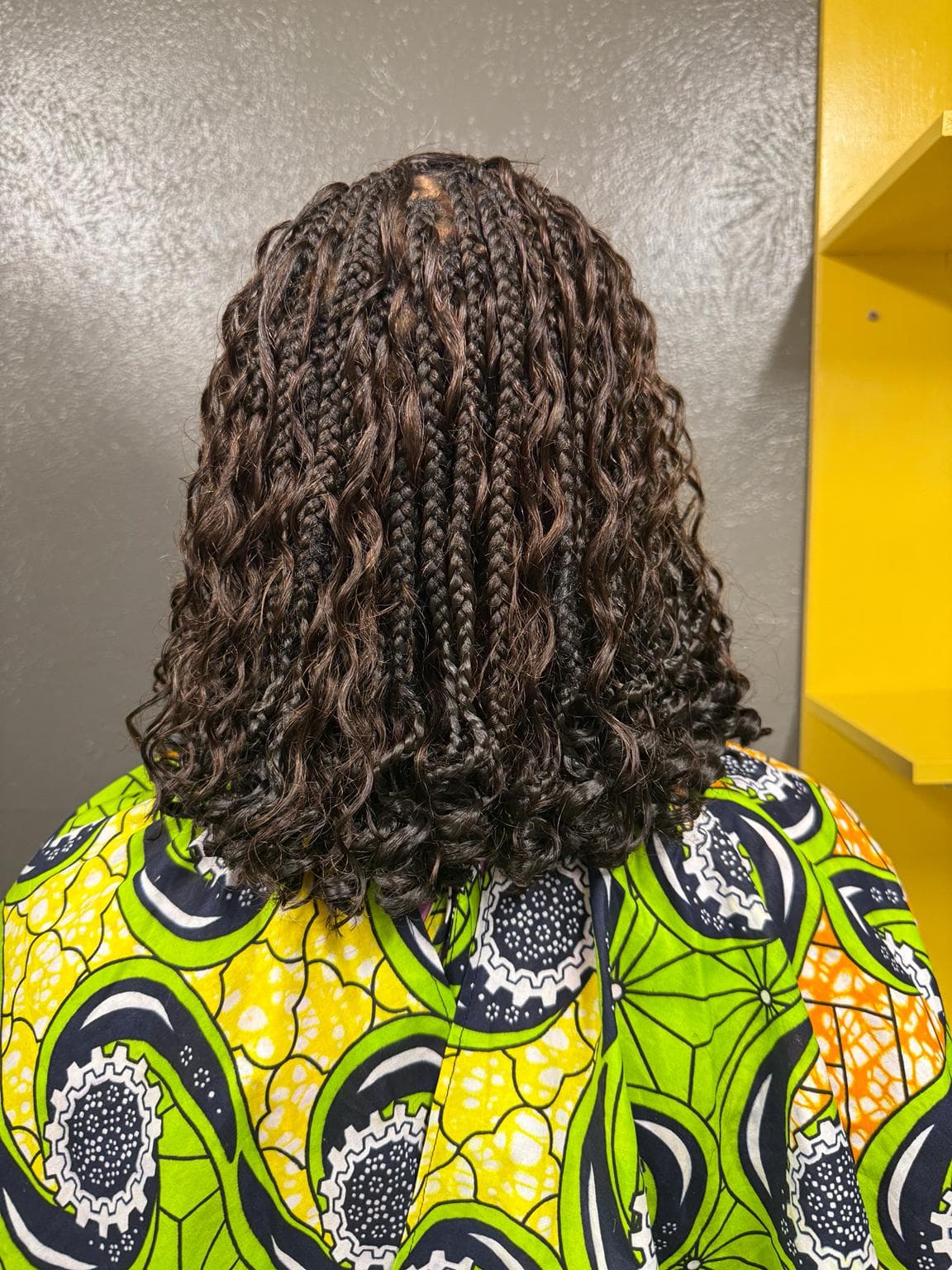 Short Black Boho Knotless Braids with loose curly ends back view