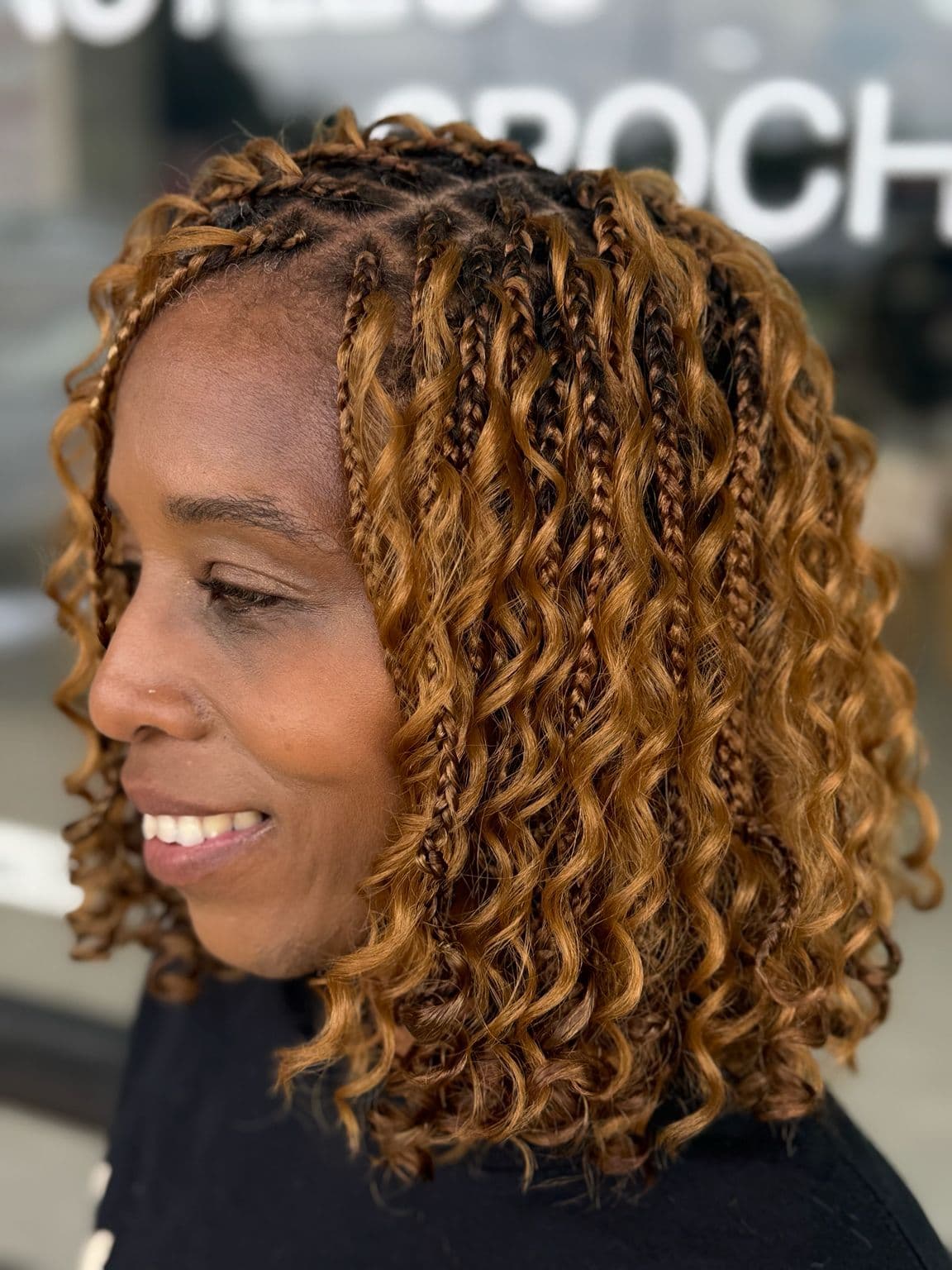 Short brown Boho Knotless Braids soft loose curls side view
